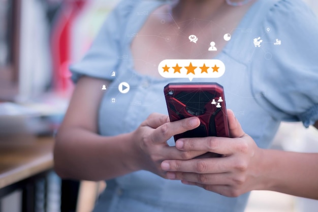 Blurred woman holding smatphone background with Customer satisfaction feedback survey concept