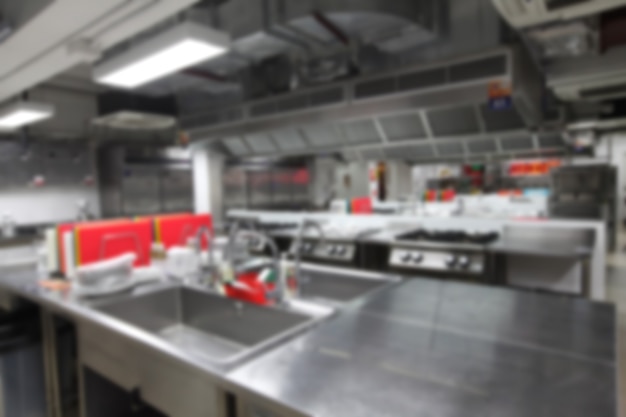 Blurry background of kitchen with cooking equipment, Nobody inside.