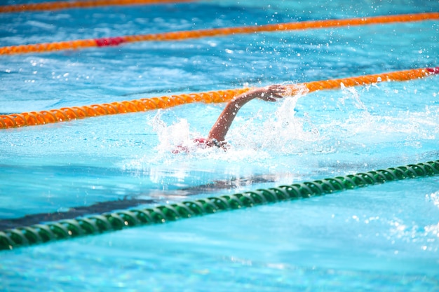 Blurry background of splash drop water on swimming race.