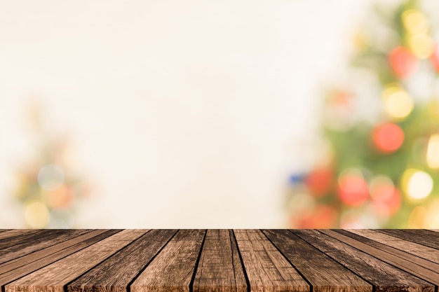 Blurry Christmas tree with plank wooden texture floor background