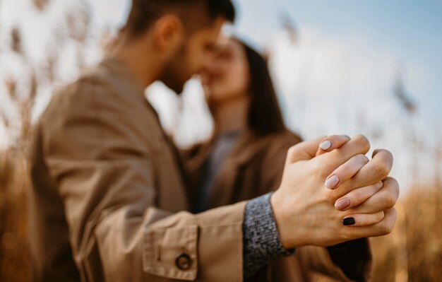 Blurry couple holding hands