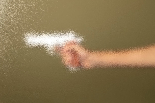 Blurry filter on a hand holding handgun