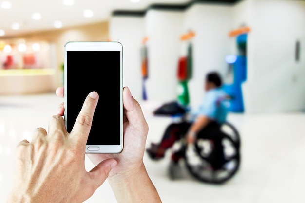 Photo blurry images of disabled people selling lottery tickets