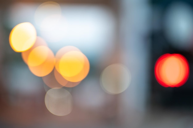 A blurry picture of a traffic light with the lights on.