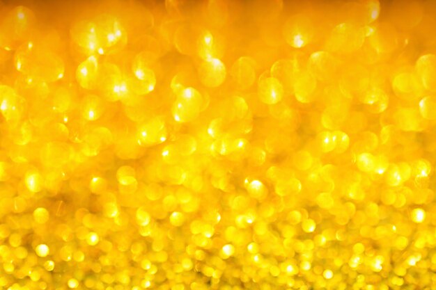 Blurry shiny gold glitter abstract golden background