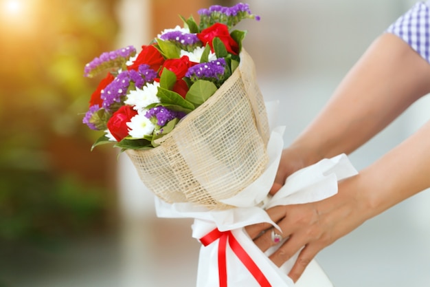 Blurry of Woman holding a bouquet of roses in hand for Valentine's Day