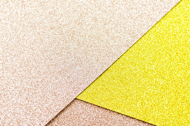 Photo blush pink and yellow shiny glitter paper background abstract and holiday backdrop