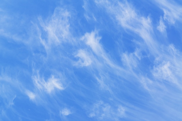 Blye sky with white fluffy clouds background	