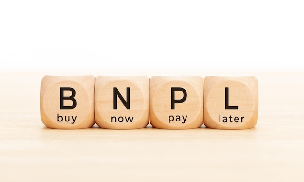 BNPL text in wooden blocks Buy now pay later concept Copy space