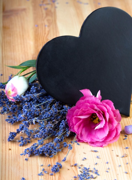 Board as heart shape for records with flowers