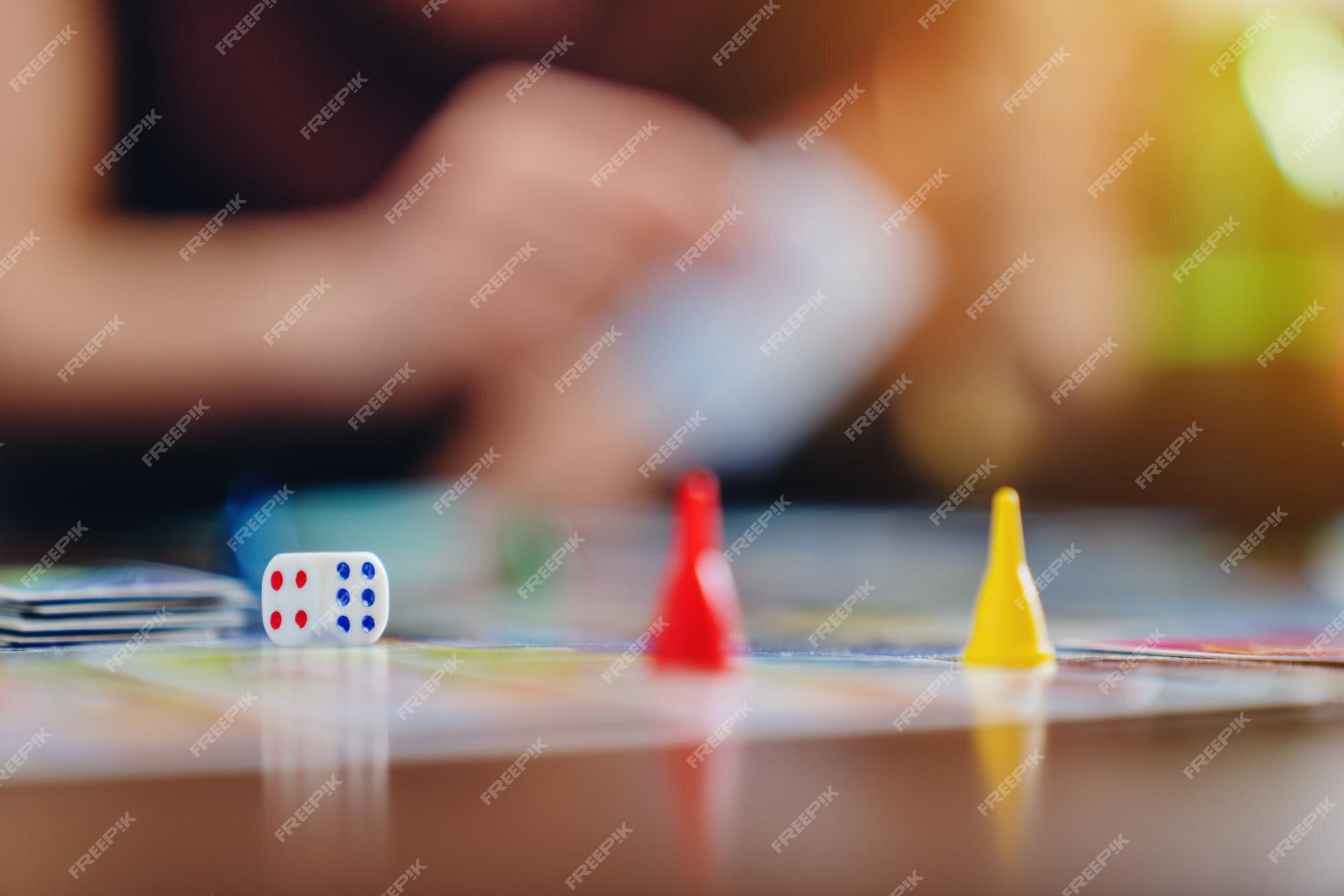 Friends Having Fun Playing Ludo Board Game while Spending Leisure