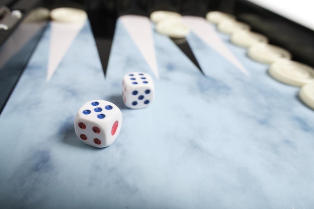 Board with cubes and chips for playing backgammon