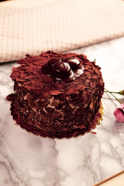 Board with delicious cake on table