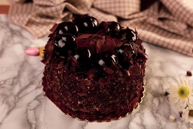 Board with delicious cake on table