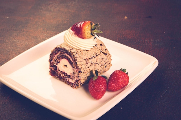 Photo board with delicious cake on table