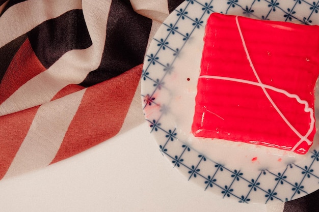 Board with delicious cake on table