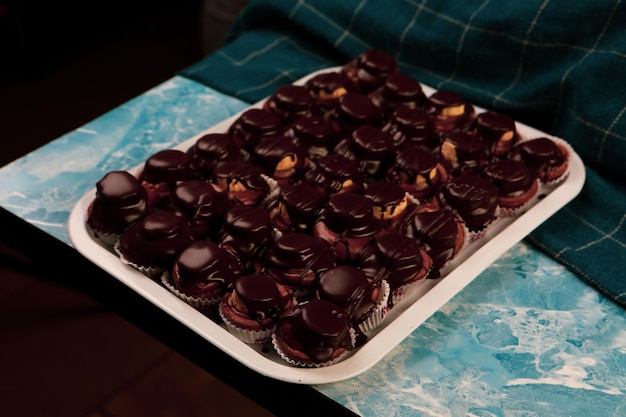 Board with delicious cake on table