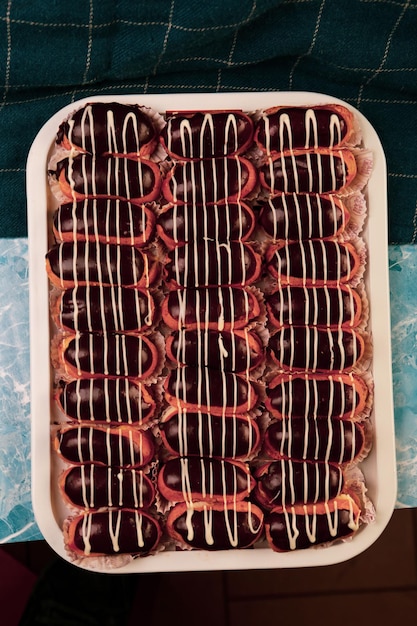 Board with delicious cake on table