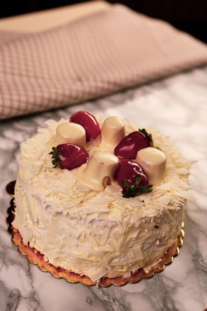 Board with delicious cake on table