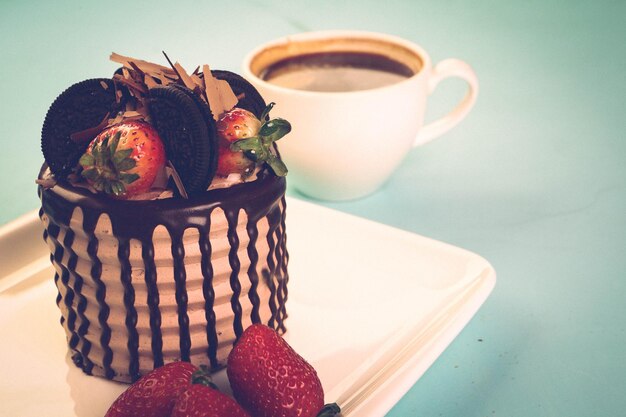 Board with delicious cake on table