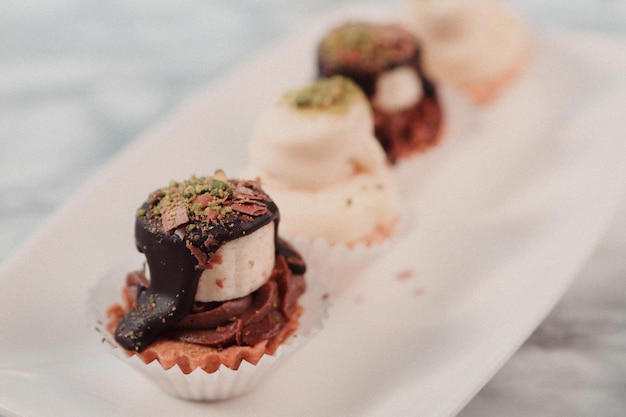 Board with delicious cake on table