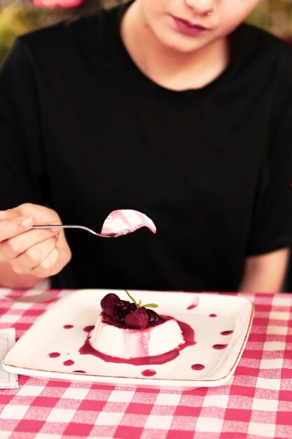 Board with delicious cake on table