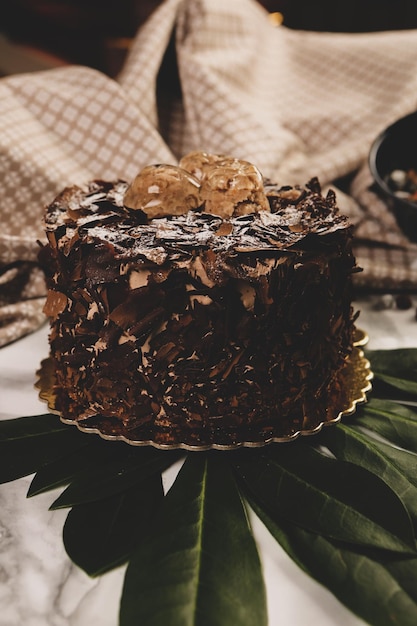 Board with delicious cake on table