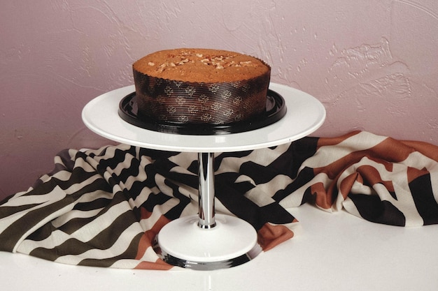 board with delicious cake on table