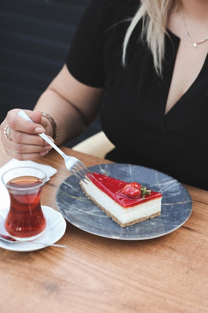 Board with delicious cake on table