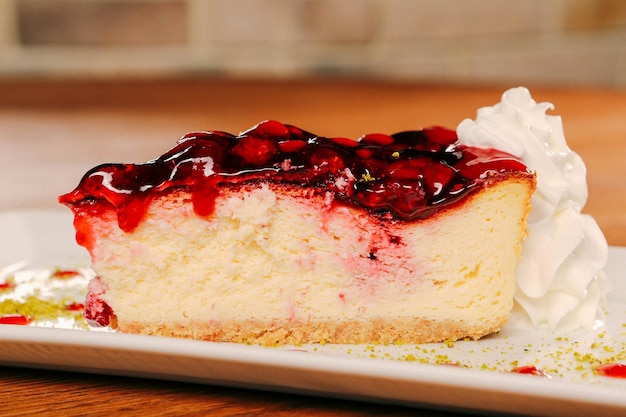 Board with delicious cake on table