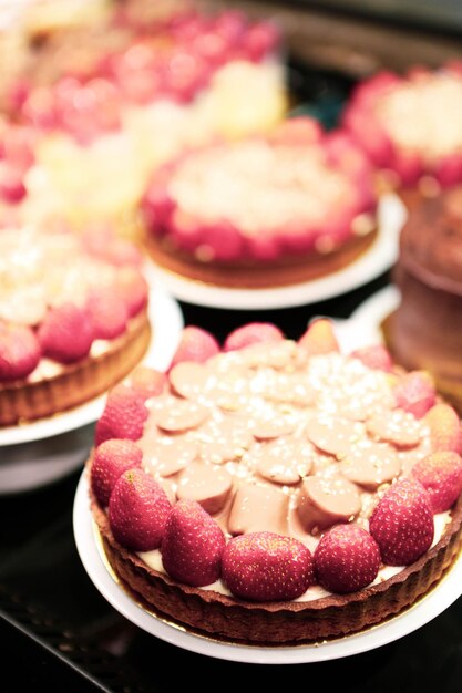 Board with delicious cake on table