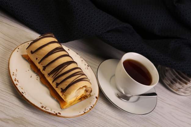 Board with delicious cake on table