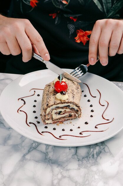 Board with delicious cake on table