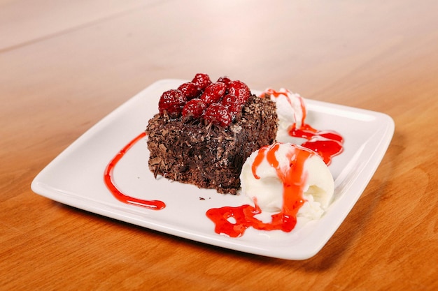 Board with delicious cake on table