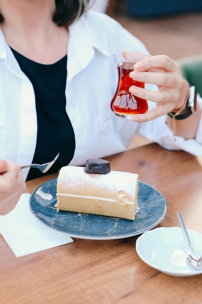 Board with delicious cake on table