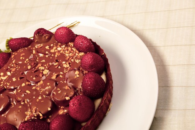 Board with delicious cake on table