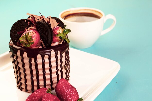 Board with delicious cake on table