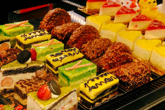 Board with delicious cake on table