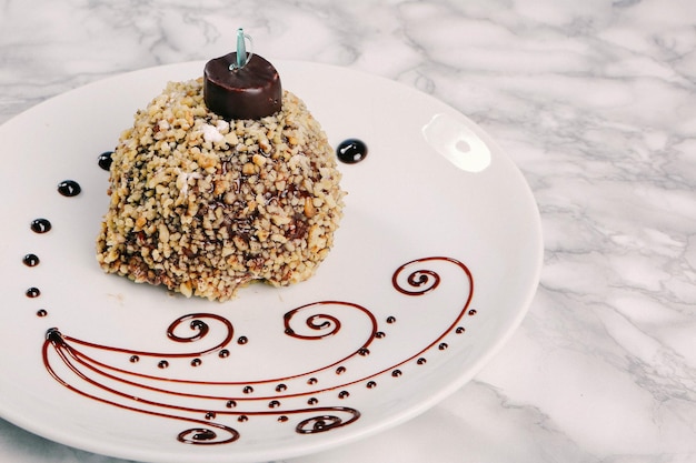 Board with delicious cake on table