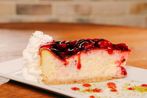 Board with delicious cake on table