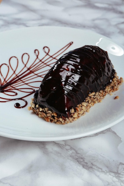 Board with delicious cake on table