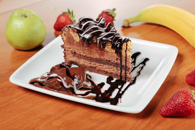 Board with delicious cake on table