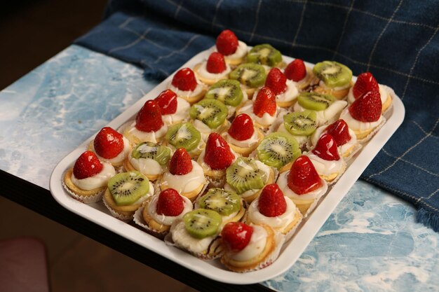 Board with delicious cake on table