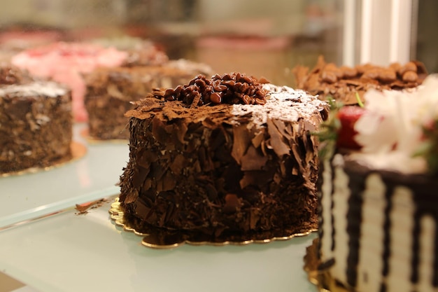 Board with delicious cake on table