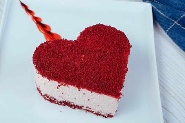 Board with delicious cake on table