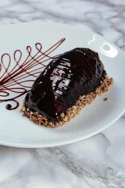 Board with delicious cake on table