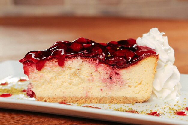 Board with delicious cake on table