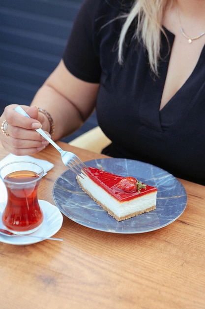 Board with delicious cake on table