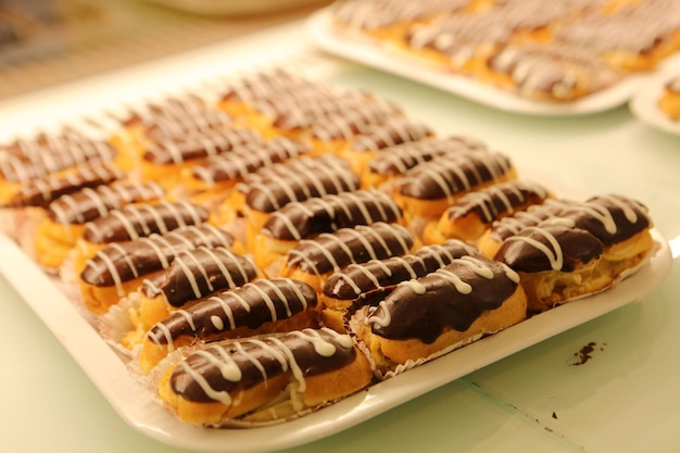 Board with delicious cake on table