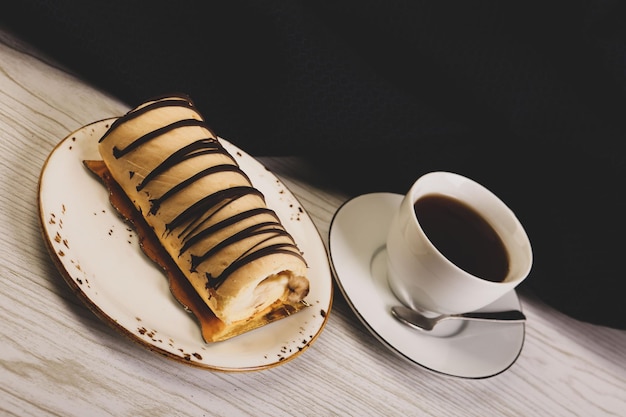 Board with delicious cake on table